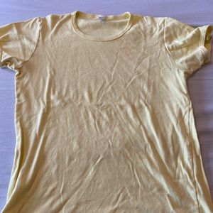 Yellow American Apparel tee runs very small